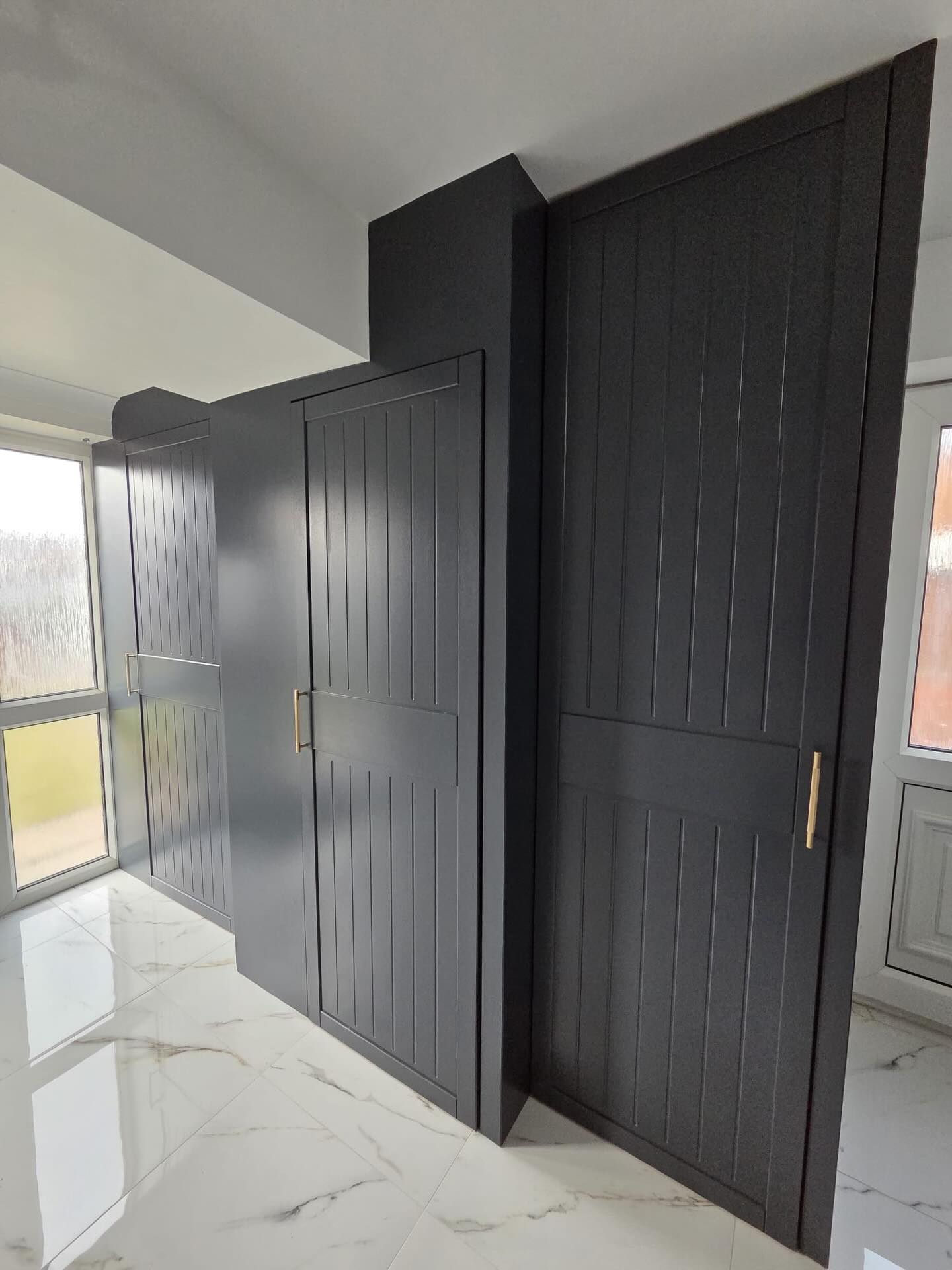 Fitted wardrobes after spraying in charcoal satinwood