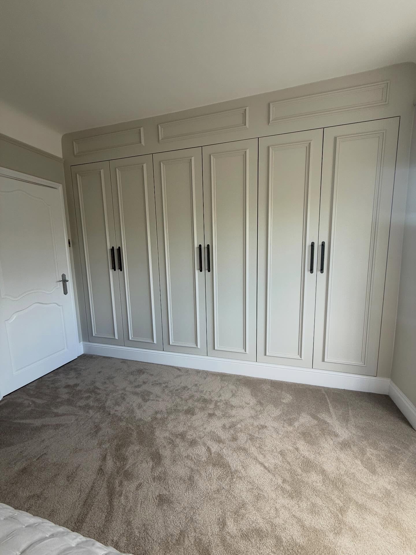 Bespoke fitted wardrobes with wall panelling